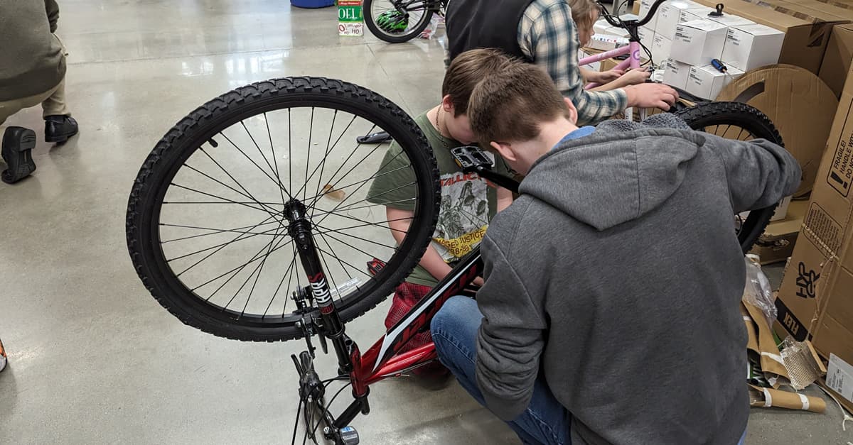 OpenEye Celebrates Community with Bike Build Event for Local School District